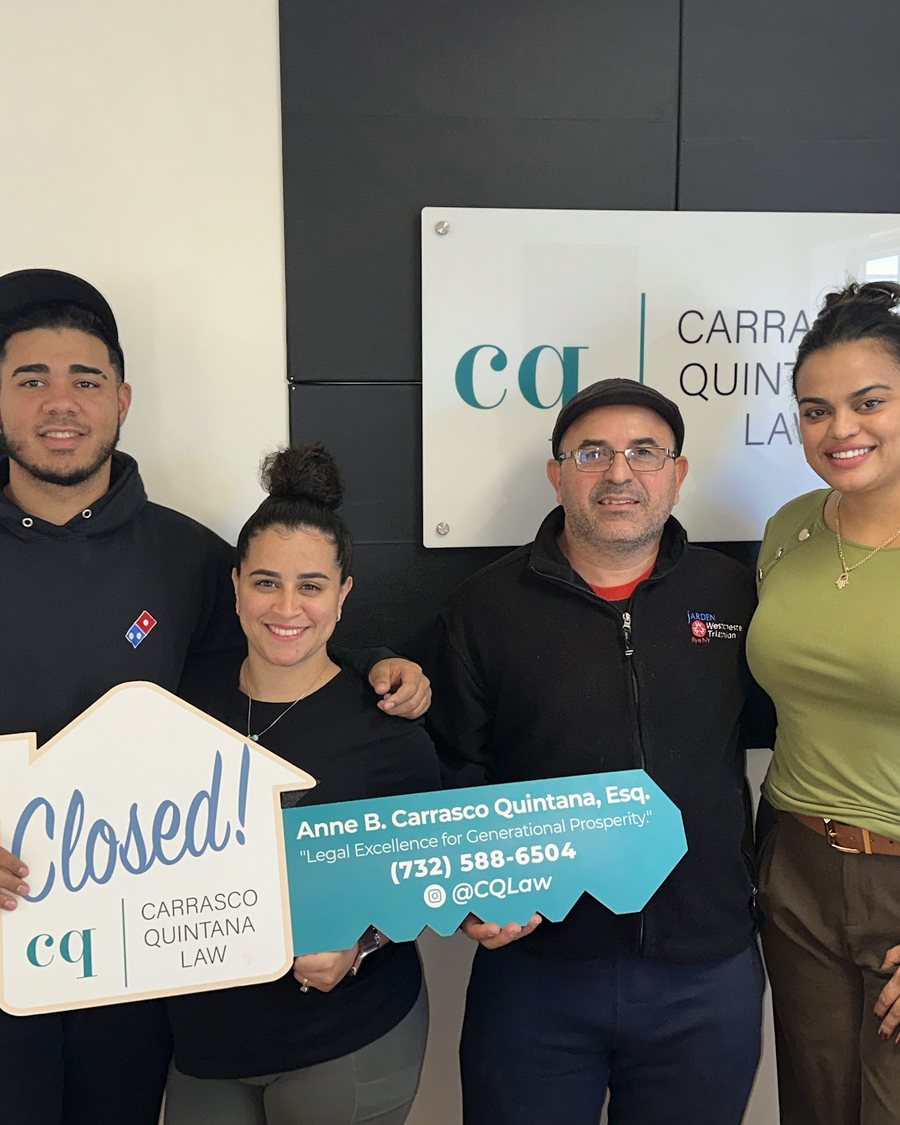 Cindy with her clients on closing day